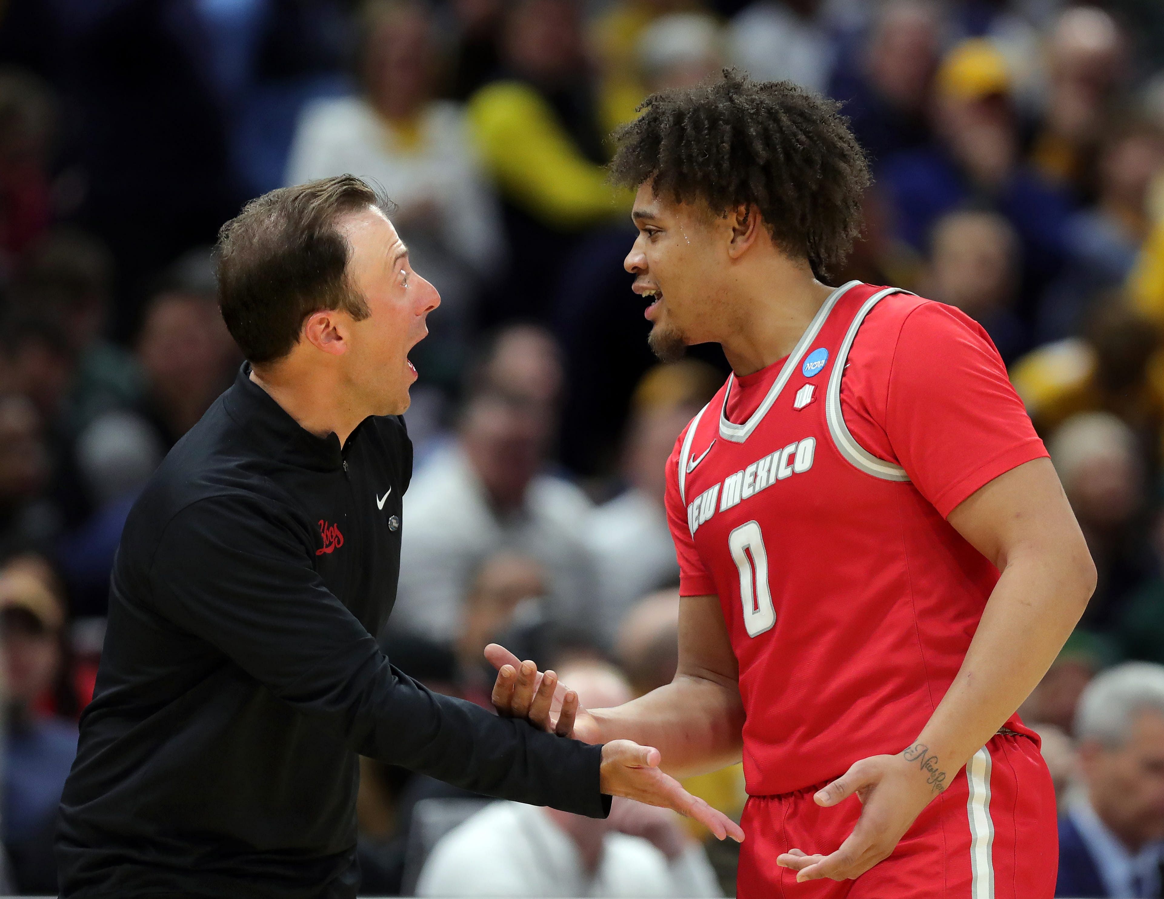 New Mexico Lobos coach Richard Pitino has a word with guard CJ Noland (#0) during the second half of their NCAA Tournament First Round game at Rocket Arena on March 21, 2025. Photo: Imagn